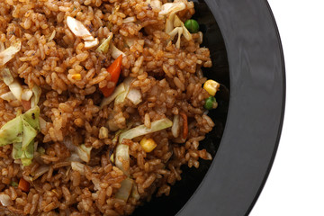 Chinese food. Rice with vegetables in soya sauce