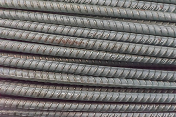 Abstract soft blurred and soft focus of surface texture of steel bar, iron wire, steel rod  with natural light in the dark room.