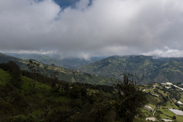 Casa del Arbol, swing and treehouse vis-a-vis volcano Tungurahua