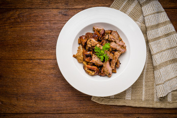 Grill pork on wooden table.  (Thai style food)