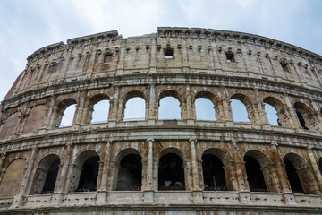 Fototapeta na wymiar The famous Colosseum in Rome - Colisseo - a huge tourist attraction in the city