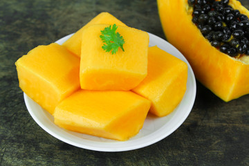 slice of sweet ripe papaya on white background