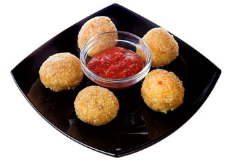 Cheese  balls on black plate