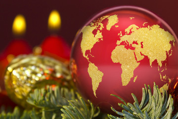 Red bauble with the golden shape of the world.(series)