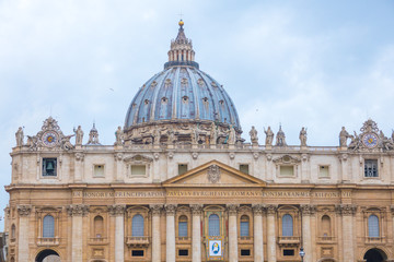 Fototapeta na wymiar The impressive front of Saint Peters Basilica in Rome - Peter s Square at Vatican City