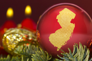 Red bauble with the golden shape of New Jersey.(series)