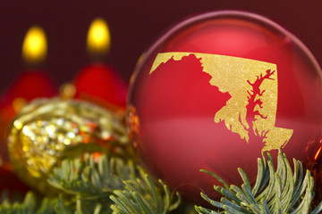 Fototapeta na wymiar Red bauble with the golden shape of Maryland.(series)