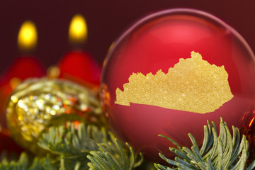 Red bauble with the golden shape of Kentucky.(series)