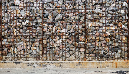 The texture of the stones and wire