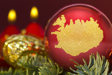 Red bauble with the golden shape of Iceland.(series)