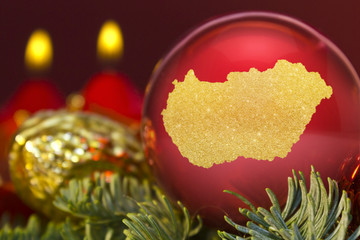 Red bauble with the golden shape of Hungary.(series)