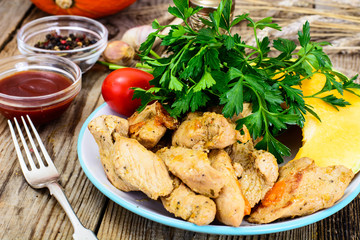 Roasted turkey breast with herbs, pumpkin soup and parsley on Th