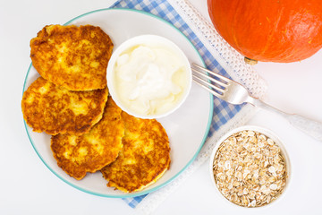 Pumpkin-oatmeal pancakes with curry on a white background