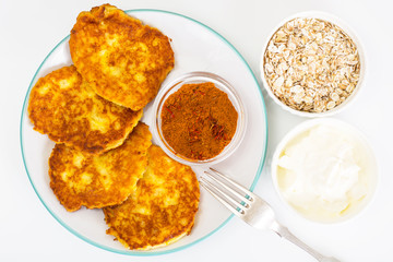 Pumpkin-oatmeal pancakes with curry on a white background