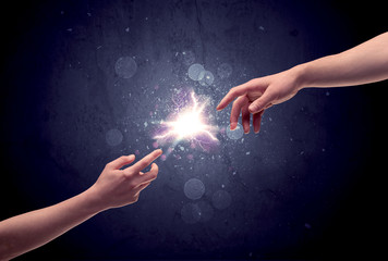 Hands reaching to light a spark