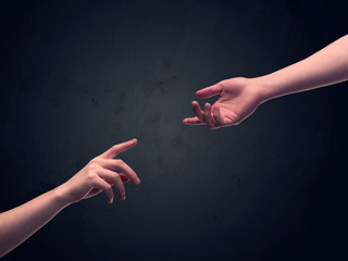Hand about to touch another one