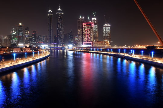 Dubai Skyline at night from new Dubai Canal, U.A.E