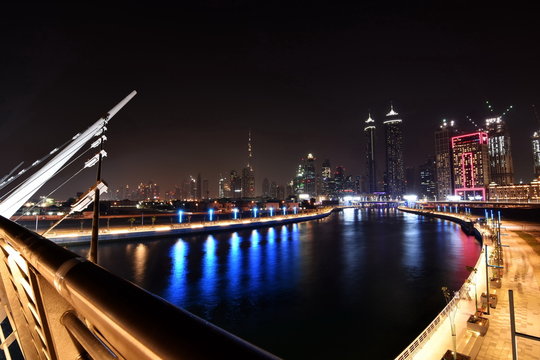 Dubai Skyline at night from new Dubai Canal, U.A.E