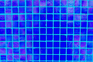 Blue mosaic tile on the floor of swimming pool