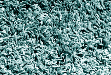 Cyan color carpet surface.
