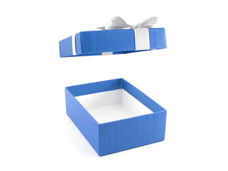 open empty blue gift box with white ribbon bow (lid is floating in the air) isolated on white background, rectangle cardboard box wrapped with light blue color paper and tied bow for put presents