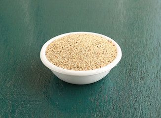 Poppy seeds, which is rich in calcium and is used as an ingredient in food like muffin, rusk, cake and bagels, in a bowl.