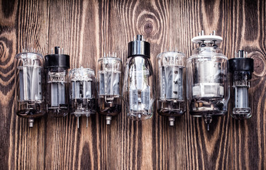 different generations of electronic vacuum tubes. closeup view.