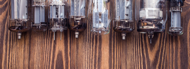 vintage background with glass vacuum radio tubes.