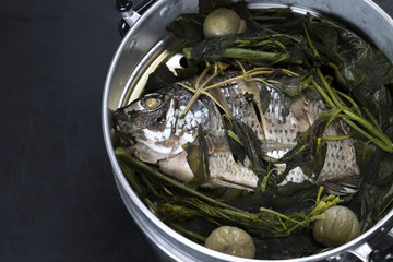 Steamed fish with vegetables and ingredients, thai food