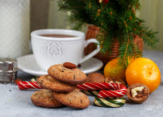 Christmas cookies with chocolate and nuts, tangerines and sweets on the table. Christmas. New year. Selective focus