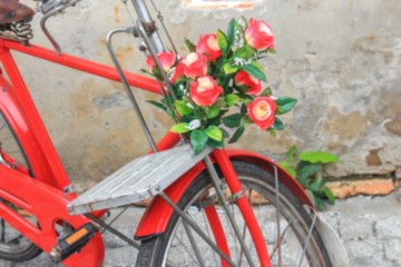 Fototapeta na wymiar Blur blurred classic vintage bicycle and flower for background
