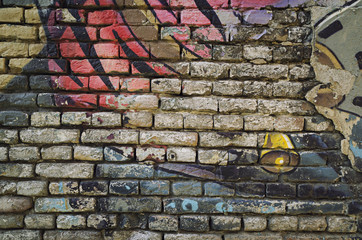 Old graffiti brick wall background texture
