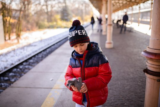 Little child boy waiting for the train