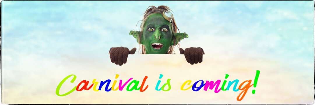 kleiner Kobold schaut &uuml;ber englischen Text, Carnival is coming