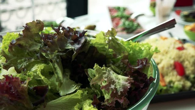 detail of salad on the table - other meals (Couscous) in background