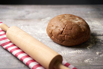 Cookie dough with dishcloth and noodle wood