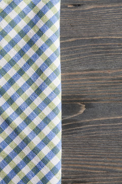 Green With Blue Checkered Napkin On Gray Wooden Table