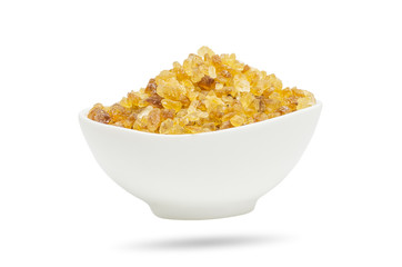 Rock sugar in cup isolated