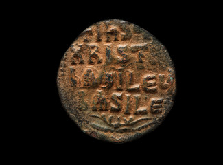 Ancient coin made of copper with religious text on it