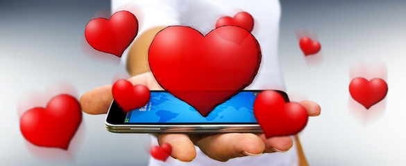 Young man holding hand drawn red heart