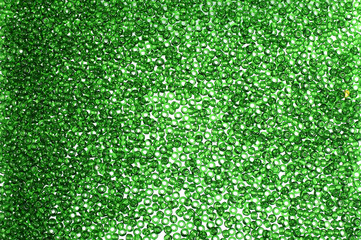Green glass beads background - closeup beads texture