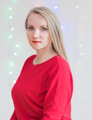 Fototapeta premium Beautiful woman on the background of colored lights.
