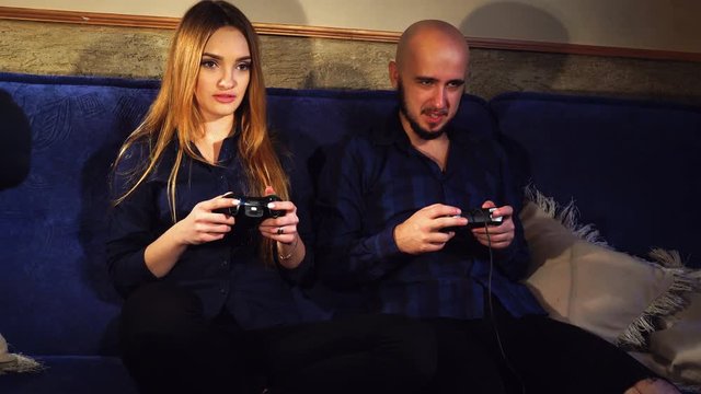 guy and girl are playing computer games