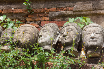 Fototapeta na wymiar Old head of Buddha at Wat Yai Chaimongkol, Ayutthaya, Thailand.