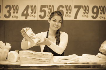 Portrait of female seller offering salo and lard