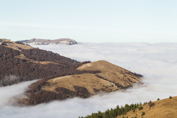 Mountain hills shrouded in low clouds, top of Demerdji in Crimea