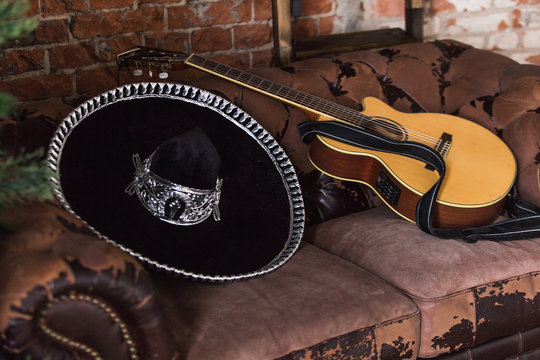 sombrero hat and guitar, sofa, studio, room, hotel, suit. 