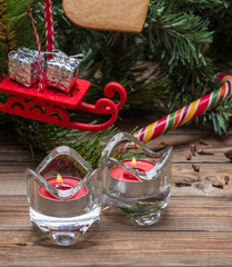 Christmas tree branches and lighted candels