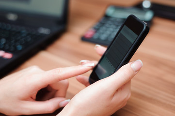 Closeup of hands of business woman working with computer