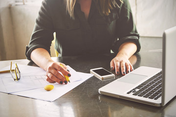 Architect woman sketching in her office